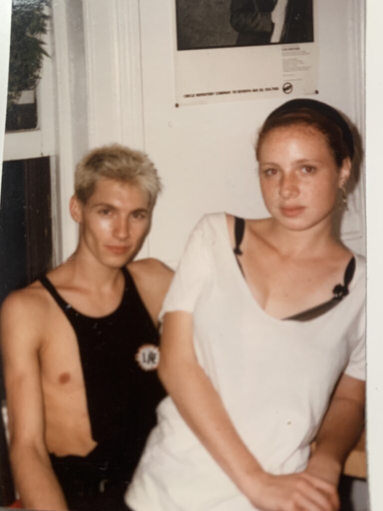 Young blond man in tank top next to Janice, age 18, 1987