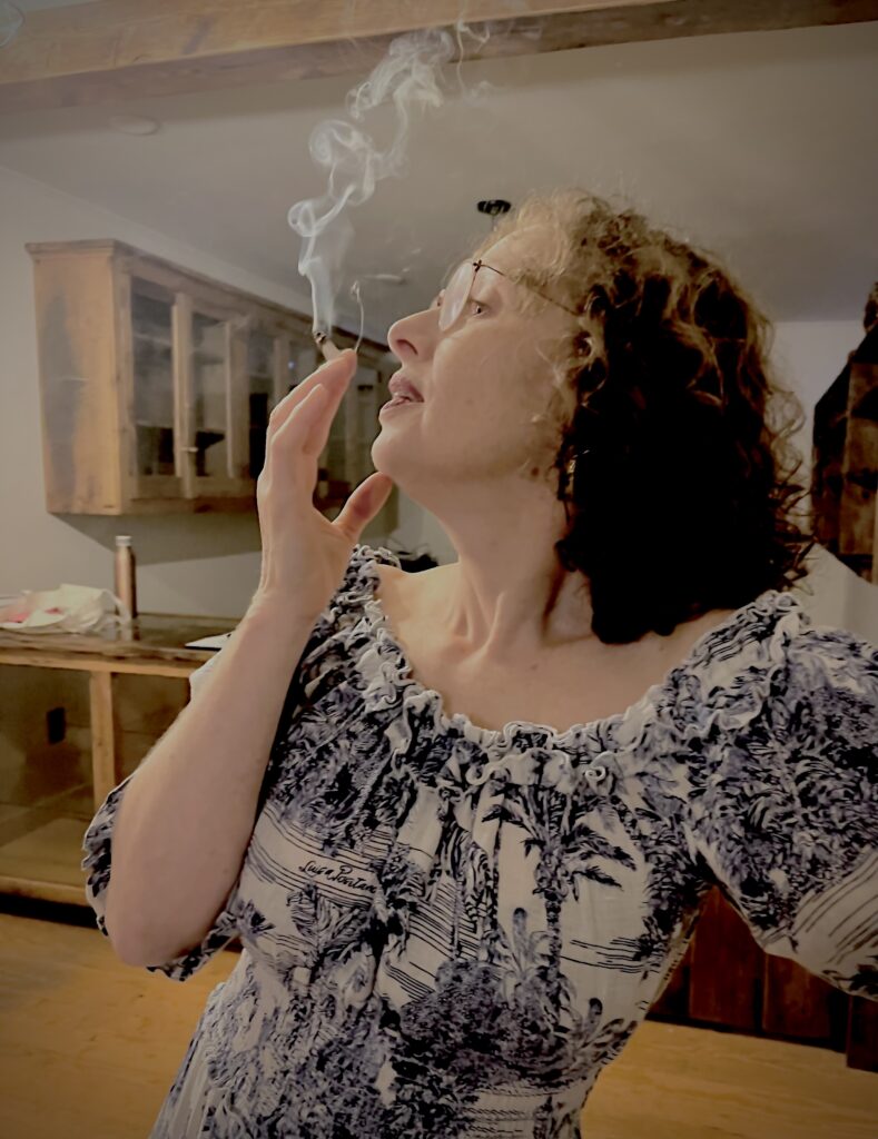 Janice in profile smoking a joint